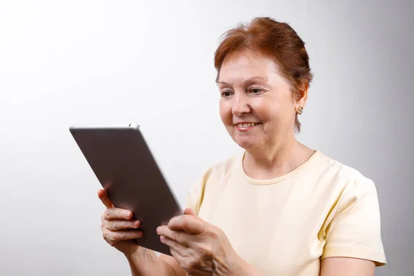 Senior Woman Looking Tablet White Background Light Shirt Place Text — Stock Photo, Image