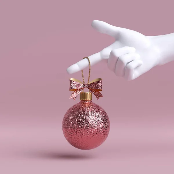 3d білий манікюр рука тримає золотий різдвяний ялинковий кульковий орнамент, прикрашений бантом, ізольований на рожевому фоні. Концепція святкової моди. Святковий кліпарт . — стокове фото