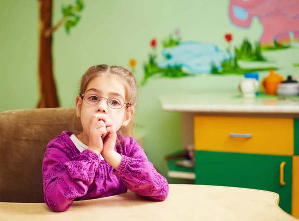 Cute little girl in kindergarten for kids with special need — Stock Photo, Image
