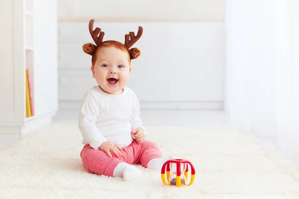 Beautiful happy baby dear playing with toy at home — Stock Photo, Image