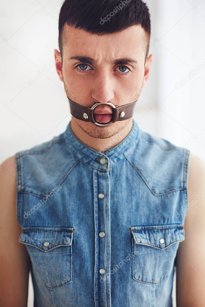 portrait of young man with face bondage