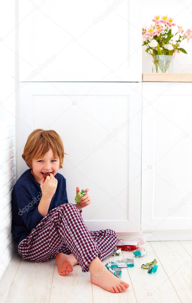 sweet tooth kid hiding in kitchen corner, eating candies