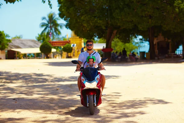 Father with son riding on scooter through the Thailand — Stock Photo, Image