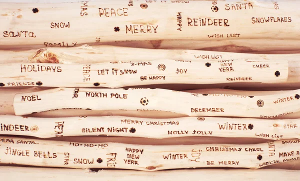 Tło Boże Narodzenie pozdrowienia napis spalony na driftwood — Zdjęcie stockowe