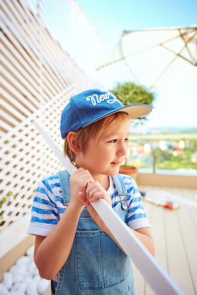 Cute young boy, kid halps father with renovation of wodden pergola wall on rooftop patio zone — Stock Photo, Image