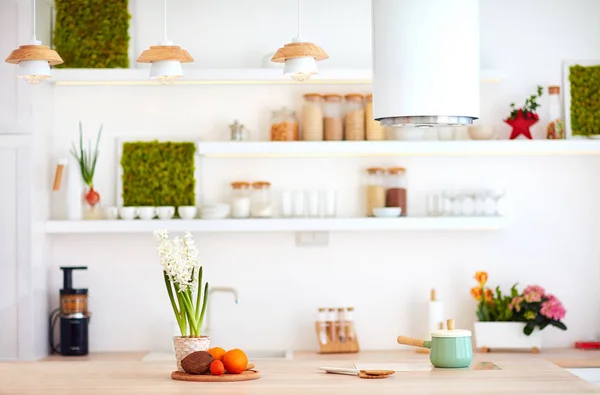 Cozy bright kitchen with wooden countertop and island cooker hood — Stock Photo, Image