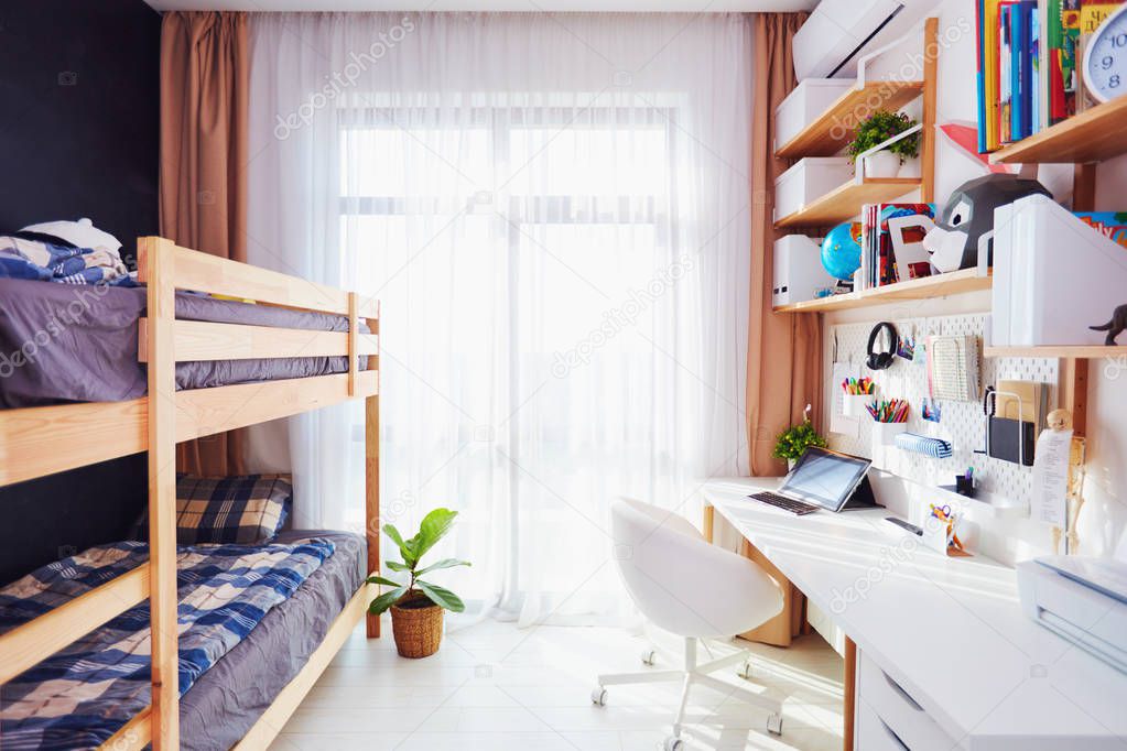 modern bright kids room with bunk bed and wall shelves