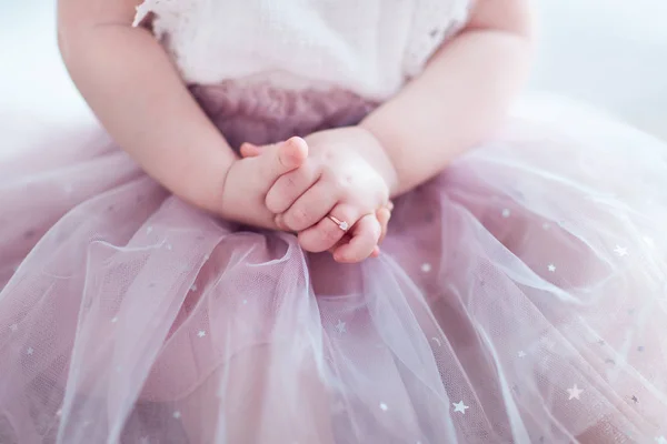 beautiful golden finger ring on the little hands of adorable toddler princess girl