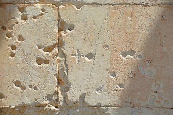 Bullet holes in the marble walls — Stock Photo, Image