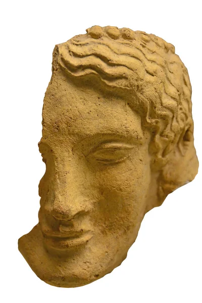 Ancient Greek Sculpture of a woman\'s head with wavy hair and a calm expression. Dated to 600BC