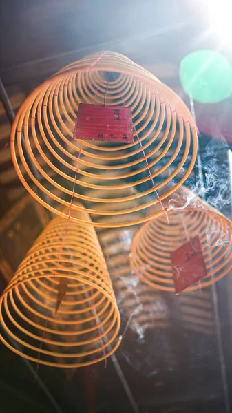 Spiral incense texture in a Chinese temple, Incense, soft focus, blurred background, film grain
