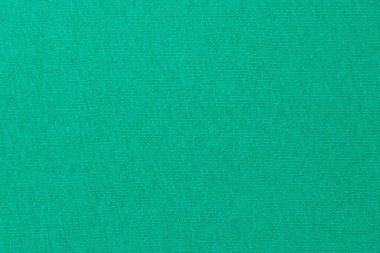 Arka plan yeşil. Örülmüş kumaş dokusu.