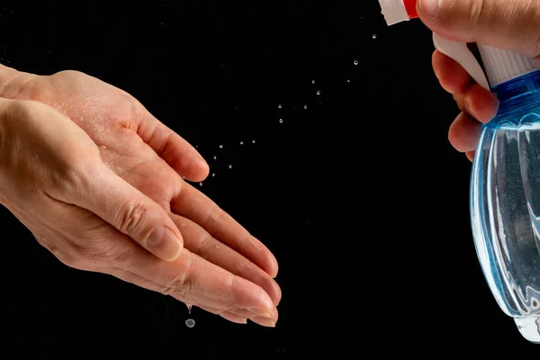 Hand treatment with an antiseptic to protect against viruses. — Stock Photo, Image