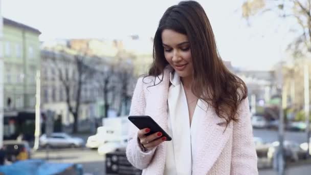 Attractive Woman Typing Messages Her Smartphone While Having Standing Street — Stock Video