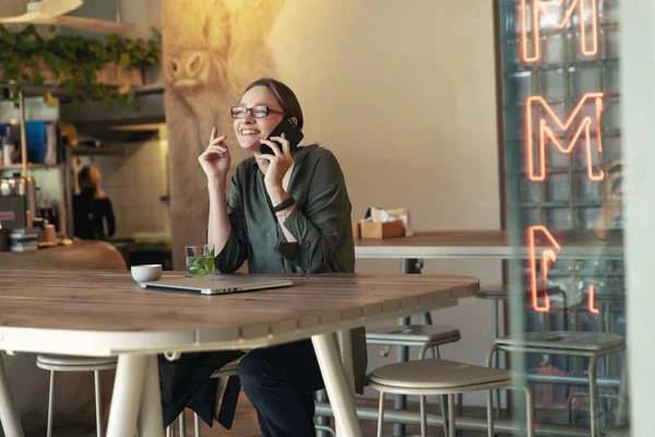 Attractive Businesswoman Black Jacket Stylish Glasses Sitting Cafe Talking Phone — Stock Photo, Image