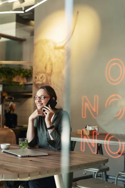 Attractive Businesswoman Black Jacket Stylish Glasses Sitting Cafe Talking Phone — Stock Photo, Image