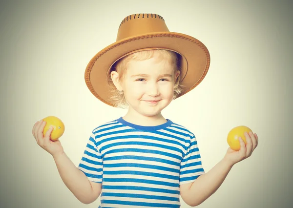 Little Funny girl keeps lemons