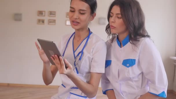 Two beautiful young doctors — Stock Video