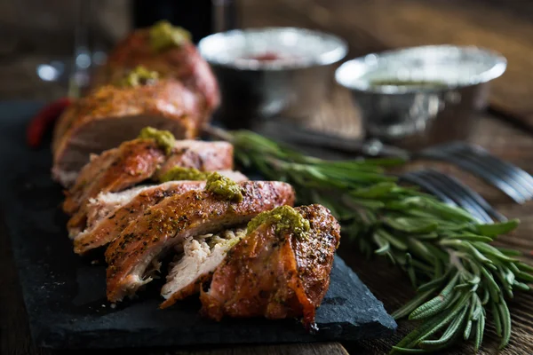 Roast pork tenderloin with herbs and red wine — Stock Photo, Image