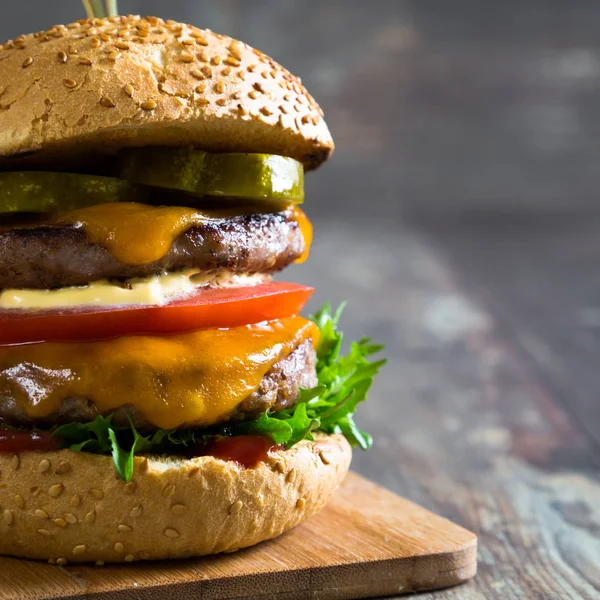 Big hamburger on table — Stock Photo, Image