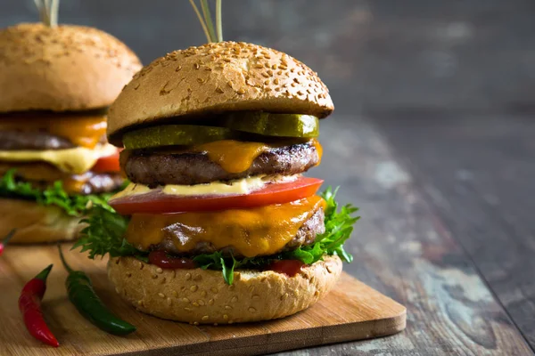 Big hamburger on table — Stock Photo, Image