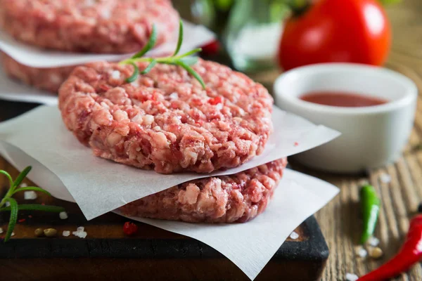 Raw burger and spices