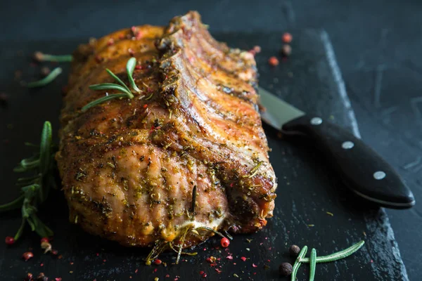 Pork loin on bone baked with herbs — Stock Photo, Image