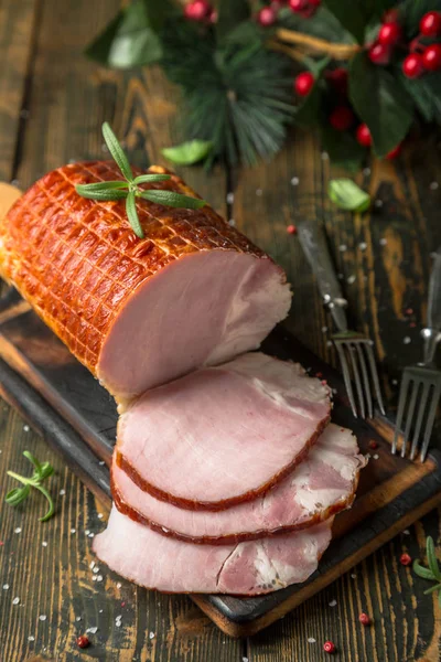 A large piece of smoked ham. Meat on the table