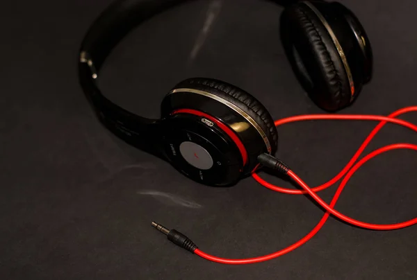 Black Background Large Headphones Listening Music Red Elements Cord — Stock Photo, Image