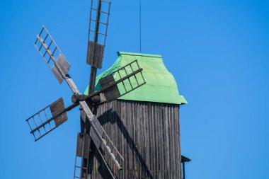 24.08.2019. Kyiv, Pirogovo-house, Ukraine.  Old wooden mills with green roofs from different parts of Ukraine. Historical heritage.