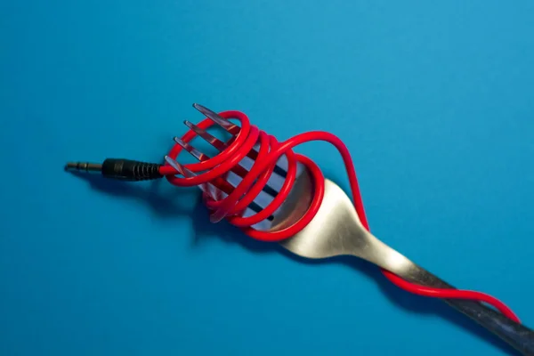 Bright Blue Background Lies Fork Wound Red Cord Headphones Spaghetti — Stock Photo, Image