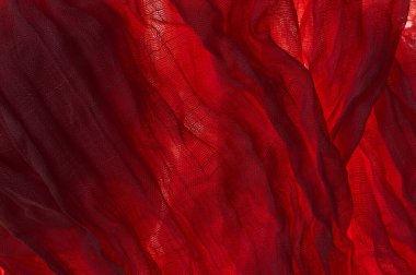 Kırmızı kehribar, elek, pamuk kumaş ve kumaşın arka planı veya dokusu.