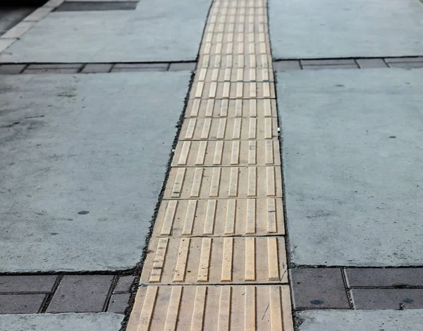 A closeup shoot to an pavement with yellow line middle of it — Stockfoto