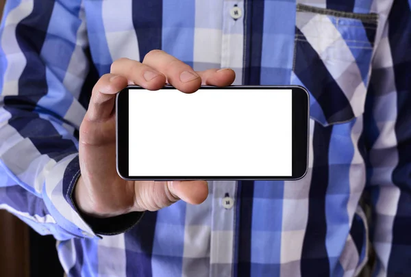 Jovem segurando telefone — Fotografia de Stock