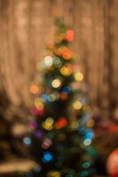 blurry Christmas tree lights. Four-pointed stars on Christmas trees, bokeh