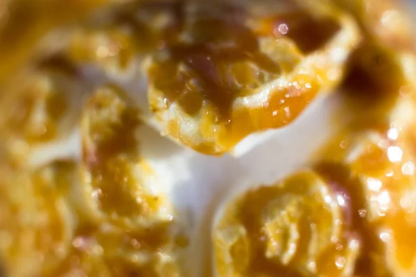Closeup of popcorn in caramel. Popcorn with brown caramel in the cracks