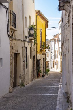 Typical Spanish house with flower pots, balconies and lanterns in Calle Santa Maria, Requena, Spain