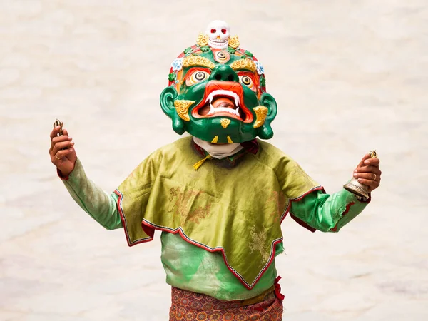 Unidentified monk with ritual bell and vajra performs a religious masked and costumed mystery dance of Tibetan Buddhism during the Cham Dance Festival — Stock Photo, Image