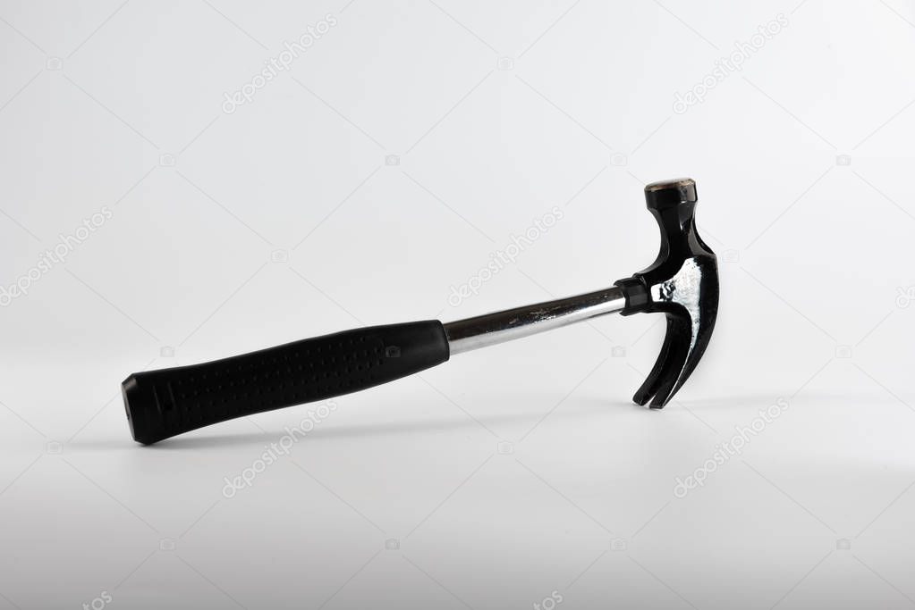 A DIY claw hammer photographed on white background