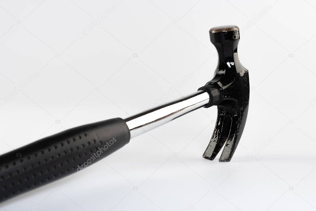A DIY claw hammer photographed on white background