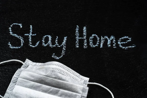 Words Stay Home on Slate Black Board. Coronavirus lockdown and stay at home concept — Stock Photo, Image