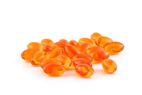 Orange dha piller heap isolerad på vit bakgrund — Stockfoto