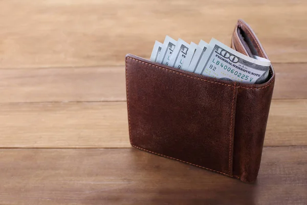 Wallet with money on wooden background — Stock Photo, Image