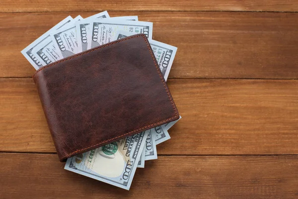 Wallet with money on wooden background — Stock Photo, Image