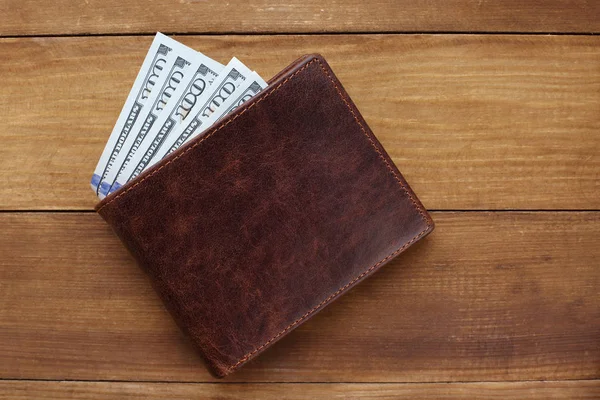 Wallet with money on wooden background — Stock Photo, Image