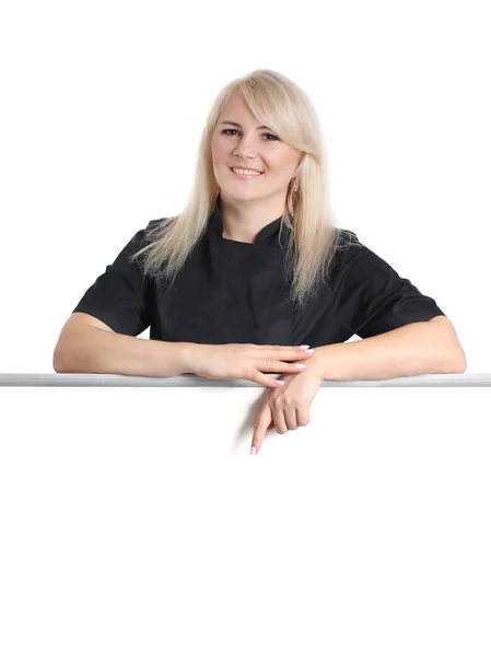 Woman chef in black uniform is showing by finger over empty whit — Stock Photo, Image