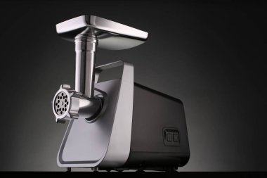 Electric meat grinder on gradient background clipart