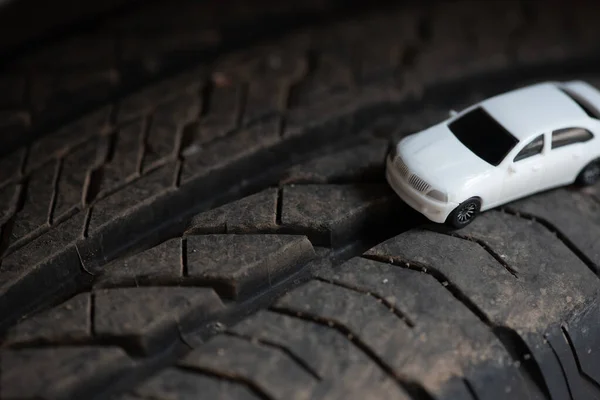 White car on the auto tire.