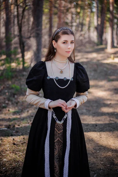Portrait Young Beautiful Woman Black Medieval Dress Standing Pine Forest — Stock Photo, Image