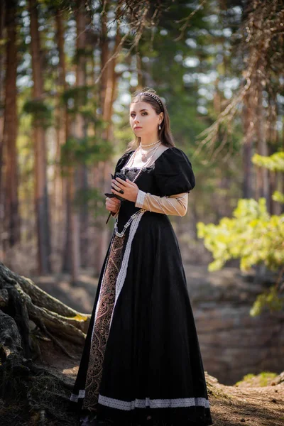 Young Beautiful Woman Black Medieval Dress Steel Rose Hand Walking — Stock Photo, Image